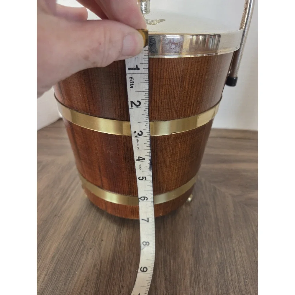vintage Jerywil wood and brass-accented footed ice bucket from the 1970s